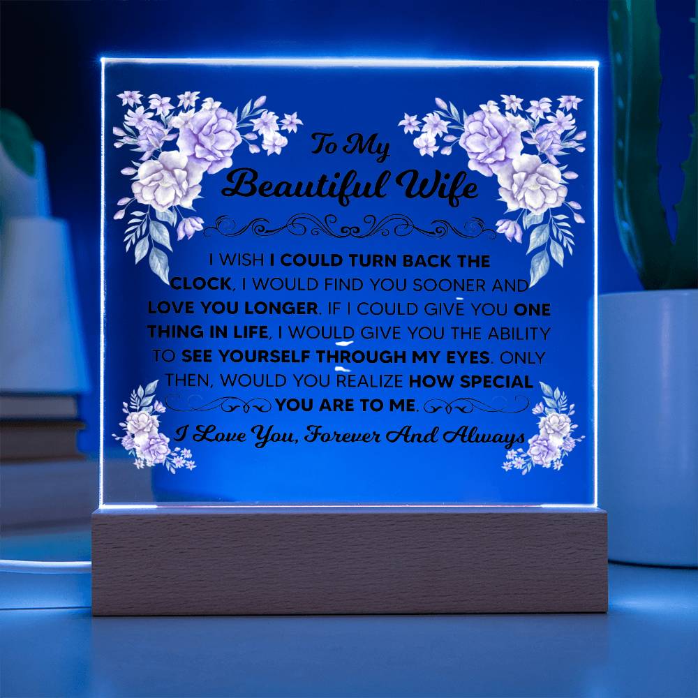 Clear acrylic wife plaque seated in a wooden corded LED display base.