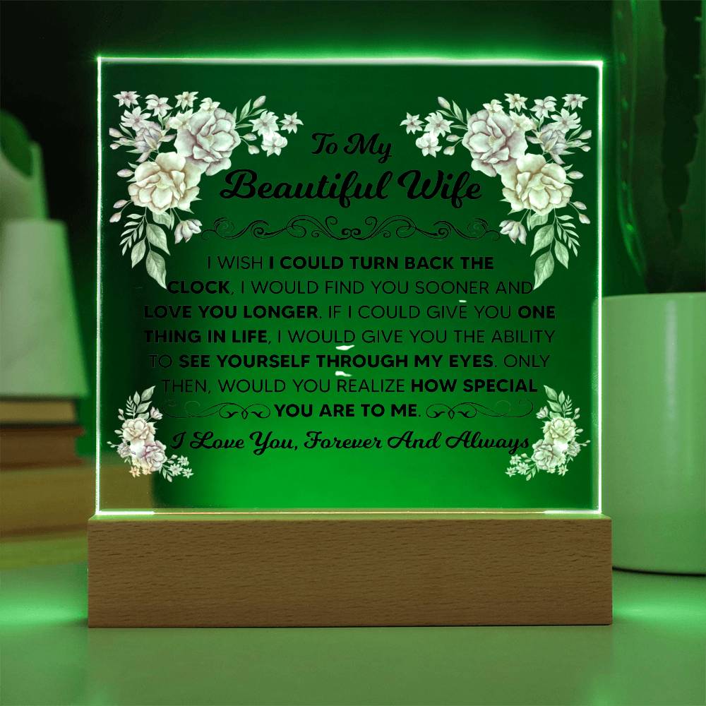 Floral acrylic plaque for a wife shown with multicolor LED lighting.